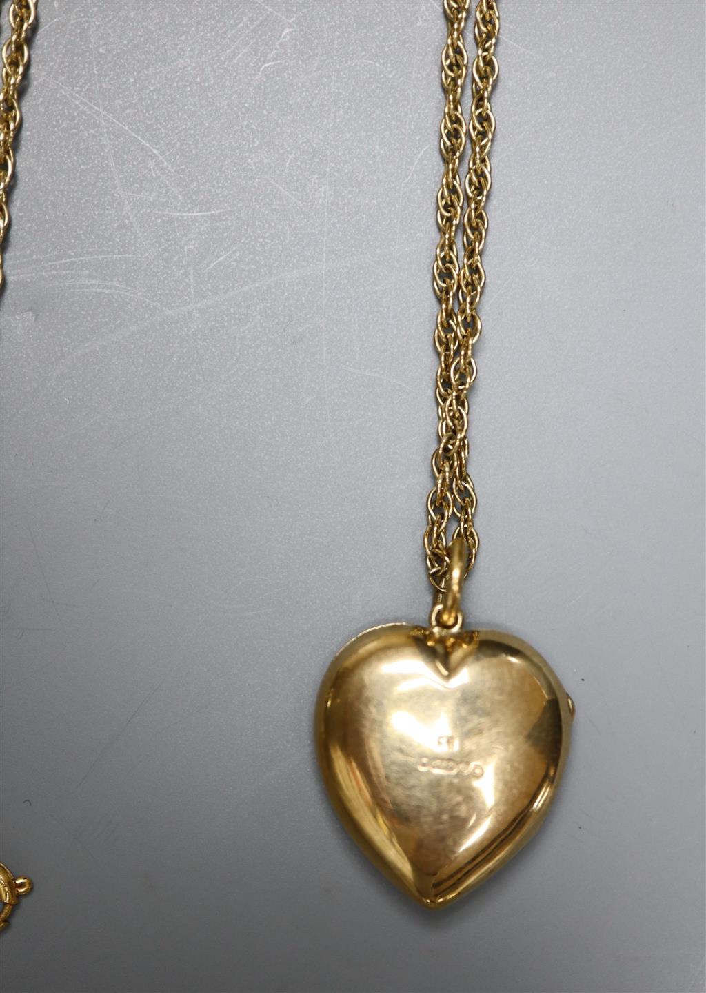 A modern pierced 9ct gold and turquoise set heart shaped locket, on a 9ct chain, gross 8.5 grams & a brooch & pr of earrings.